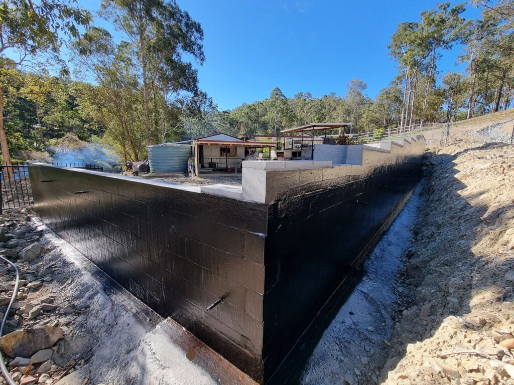 Retaining wall membrane application