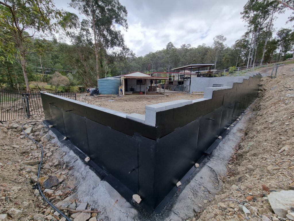 Completed retaining wall waterproofing
